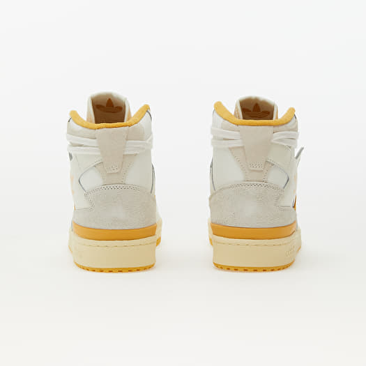 Adidas white and yellow store