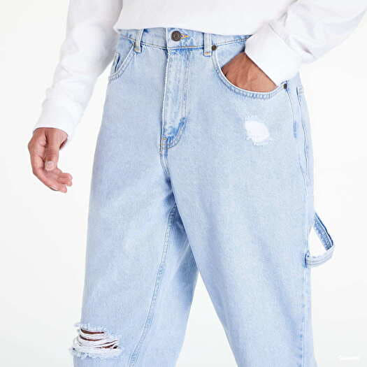 Tapered distressed jeans deals