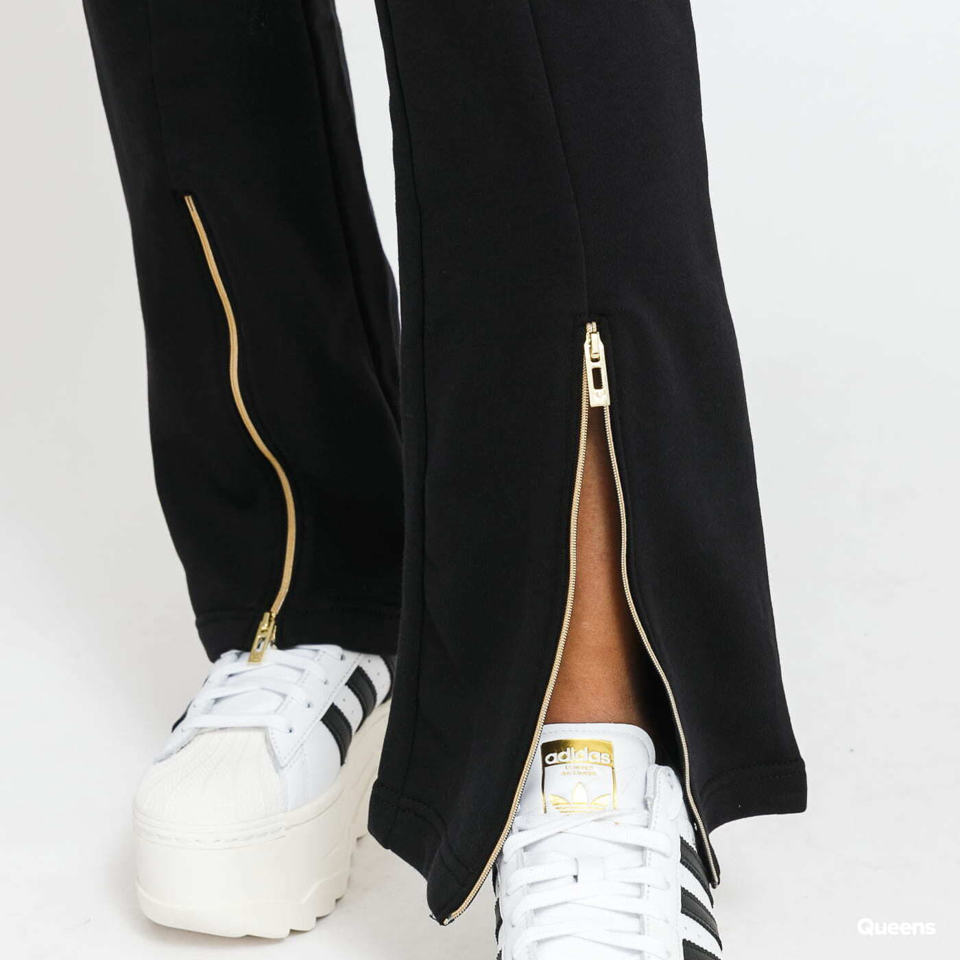 Adidas superstar track pants black gold top