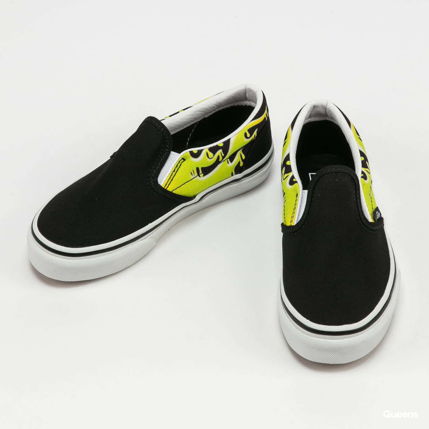 Black and yellow hotsell slip on vans