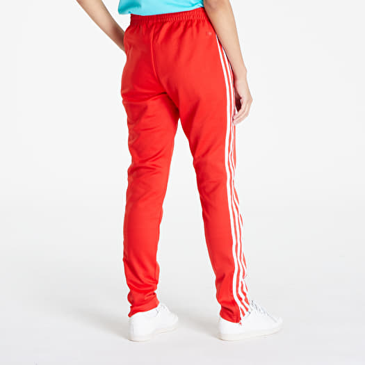 Adidas sst track pants womens red best sale