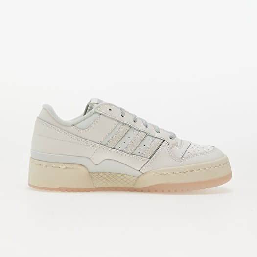 Adidas white shoes with silver stripes top