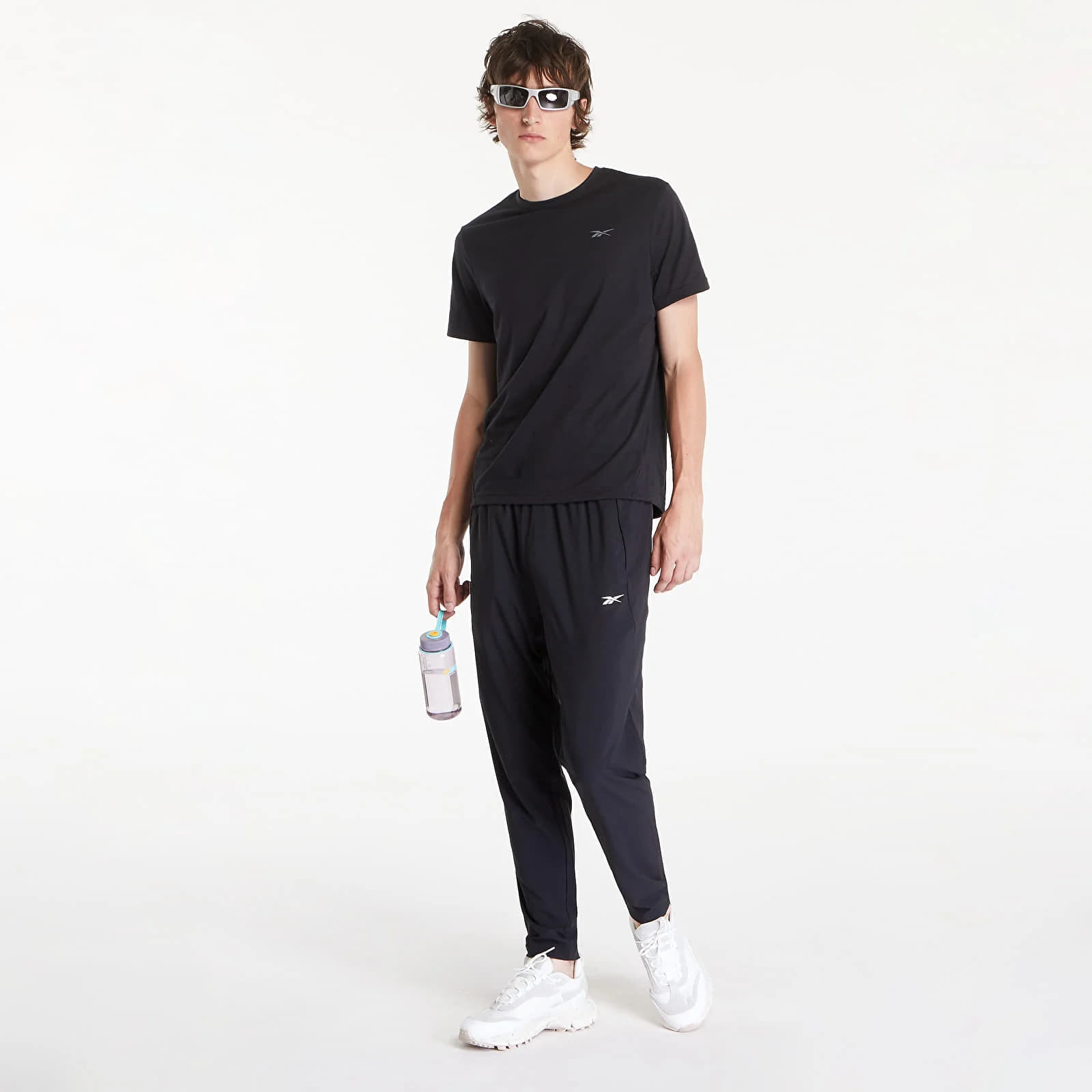 Pantaloni da uomo Reebok Id Train Woven Pant Black Queens