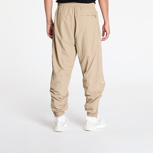 Nike khaki track pants store