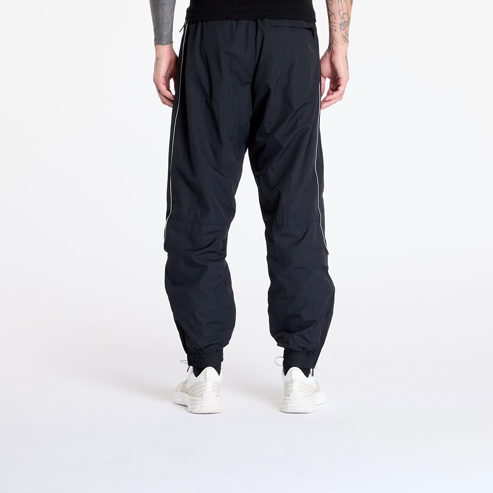 Šusťákové kalhoty Nike Solo Swoosh Men's Track Pant Black/ White