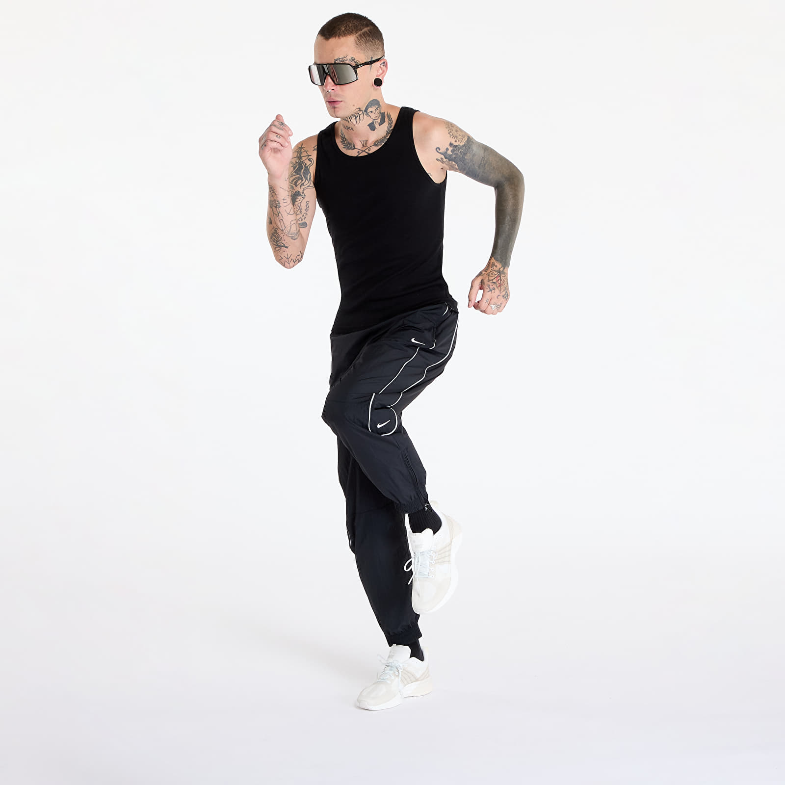Šusťákové kalhoty Nike Solo Swoosh Men's Track Pant Black/ White