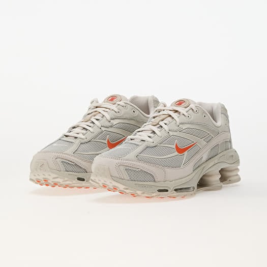 Nike shox grey and orange hot sale