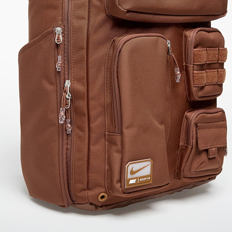 brown nike backpack Brasilia 9.5 35% polyester Spot clean The Nike Sportswear Commute Backpack (25L) is imported Nike Utility Speed Backpack Brown