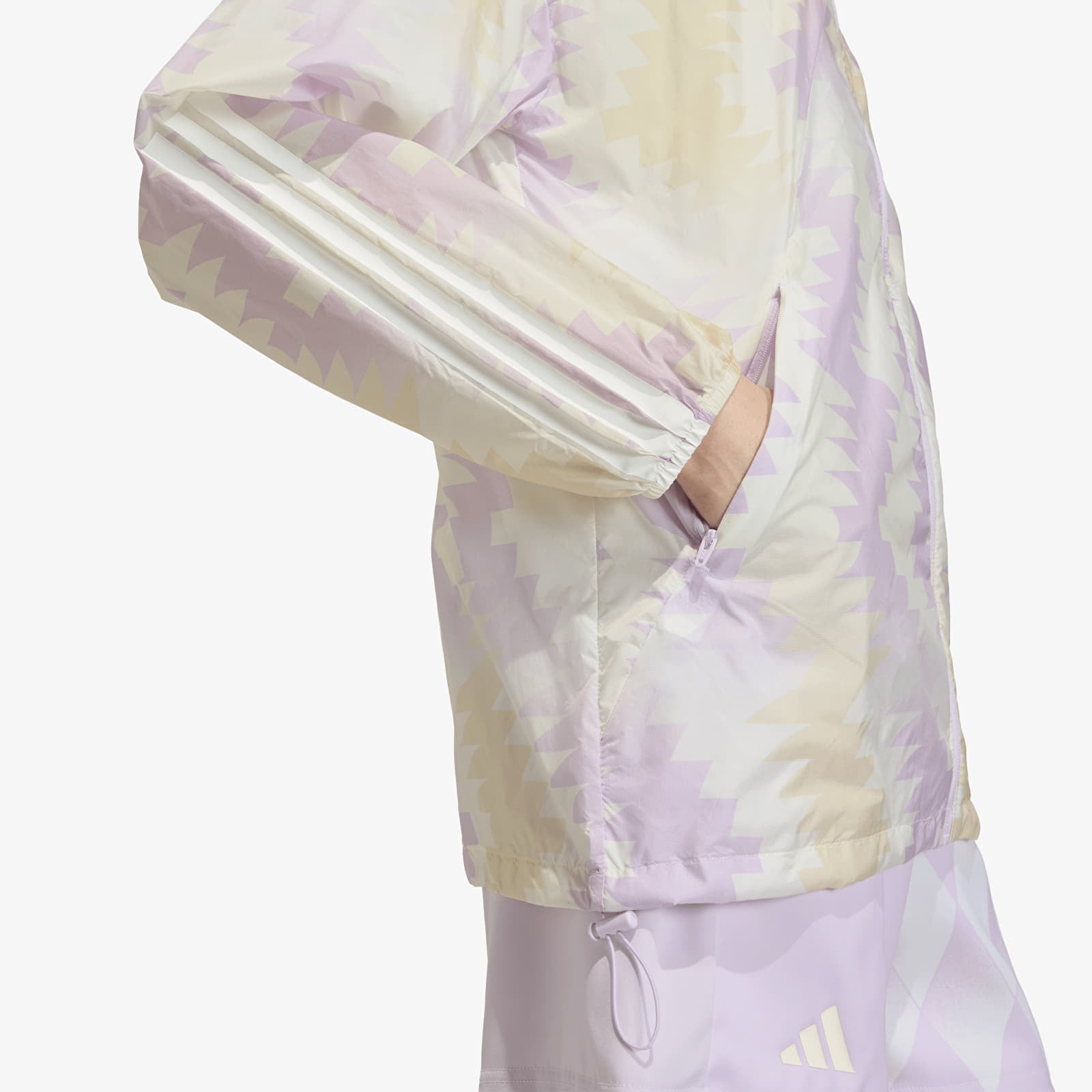 Női kabátok adidas House Of Tiro x Common Goal AOP Windbreaker Wonder White/ Off White/ Ice Lavender