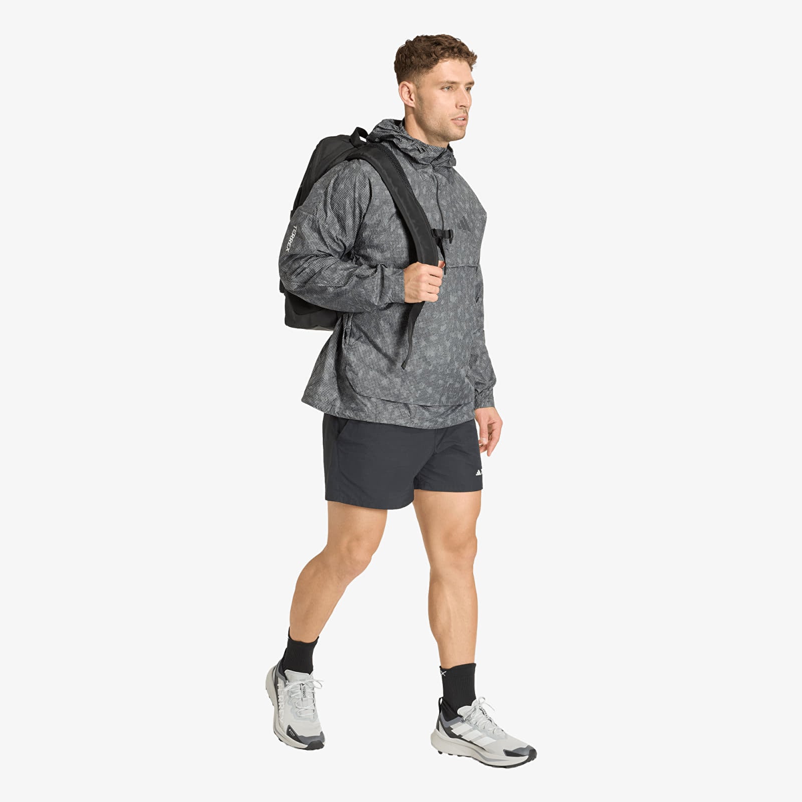 Men's windbreakers adidas Xpl Wind Aop Grey Six/ Carbon/ Black