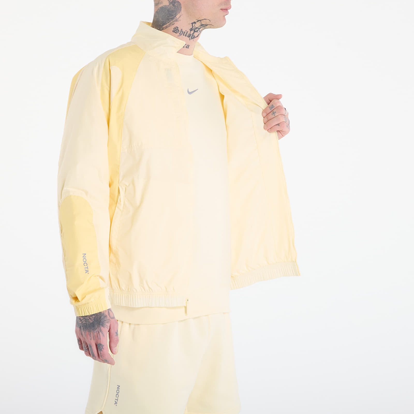 Giacche da uomo Nike x NOCTA Northstar Nylon Track Jacket Alabaster/ Lt Laser Orange/ Stealth