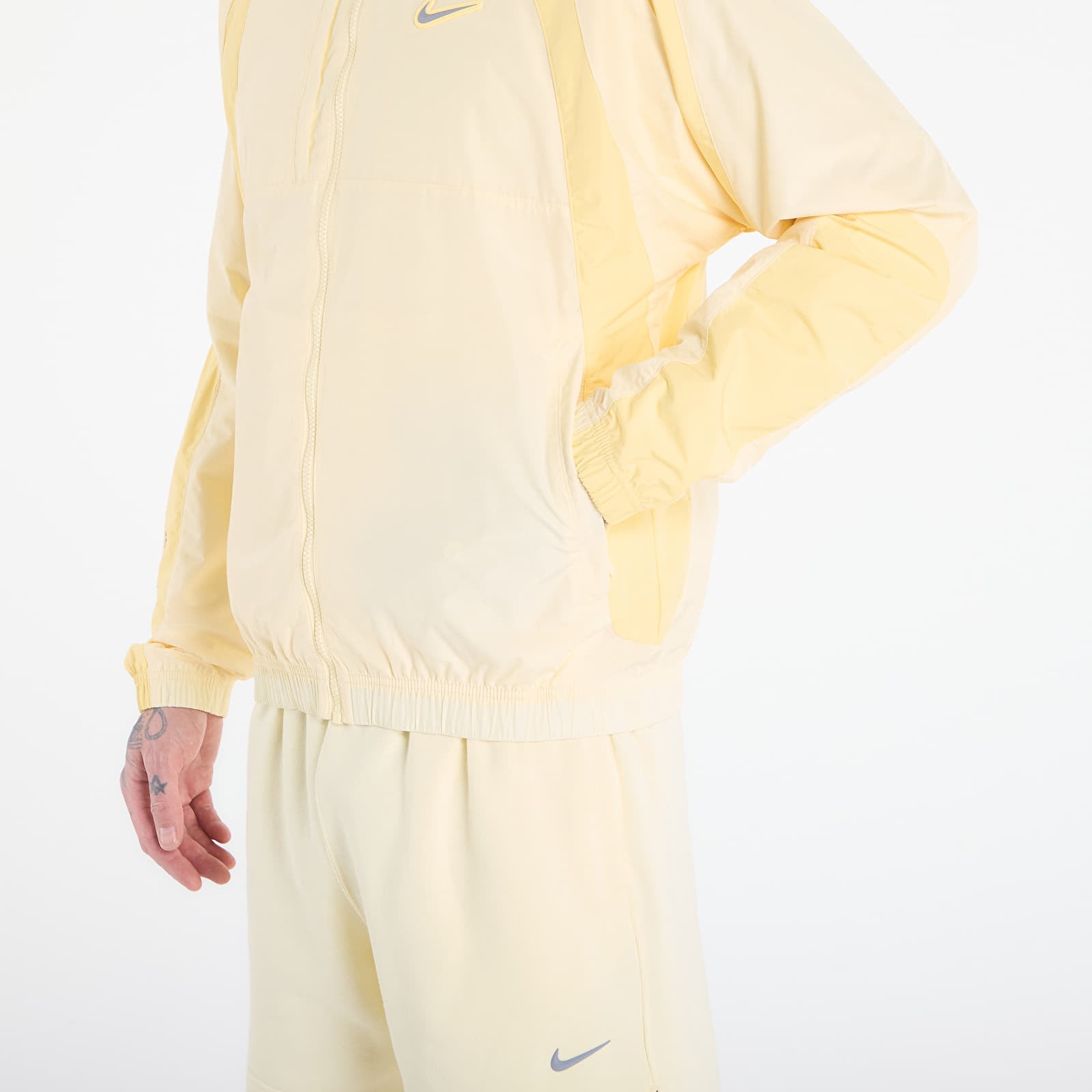 Giacche da uomo Nike x NOCTA Northstar Nylon Track Jacket Alabaster/ Lt Laser Orange/ Stealth