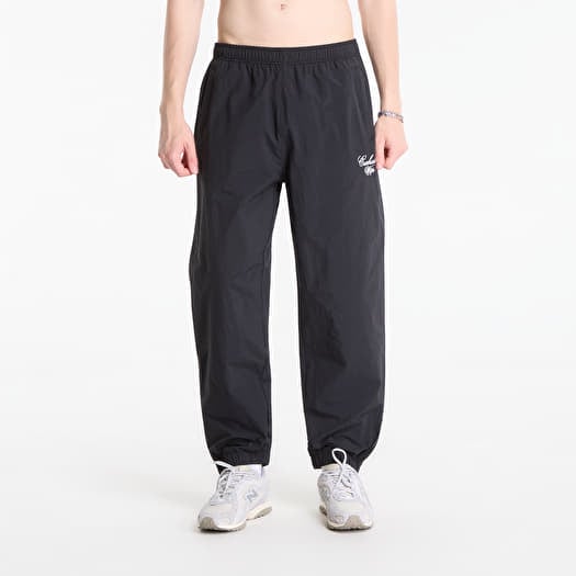 Joggebukser Carhartt WIP Travon Pant UNISEX Black/ Wax