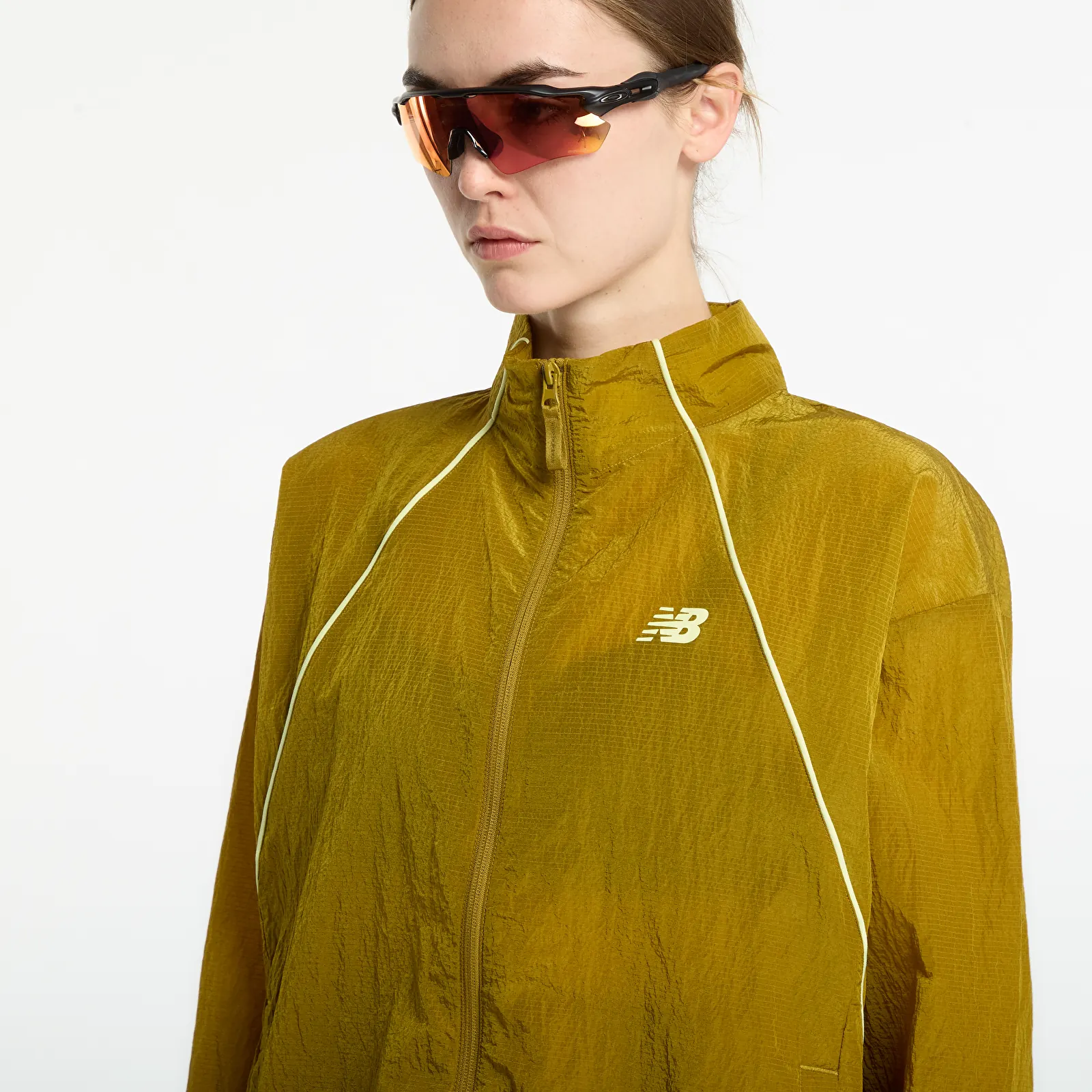 Dámske vetrovky New Balance Sport Legacy Jacket Basil Oil